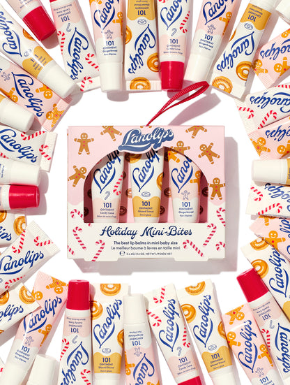 Lanolips Holiday Mini Bites lip balm gift set surrounded by tubes in Candy Cane, Gingerbread and Glazed Donut flavours, packed with rich lanolin, vitamin E and natural flavours, a holiday festive twist.